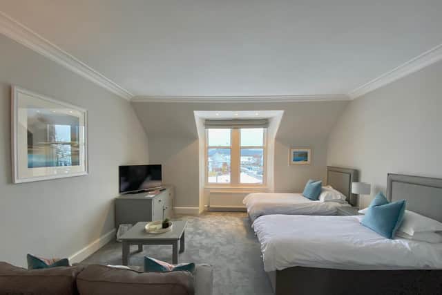 King sized beds and a sofa bed in one of the newly-refurbished Cairngorm Guest House family suites.