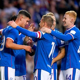 Rangers' Robbie Ure (left) celebrates with his team-mates after scoring their side's first goal of the game during the Premier Sports Cup second round match at the Ibrox against Queen of the South.