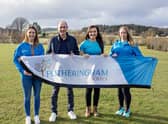 Michael Fotheringham, Director of Fotheringham Homes, with (L-R) Vicki Findlater, Hannah McGregor and Debbie Wilkinson from St Cyrus Solos Running Club.