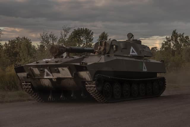 A Ukrainian serviceman drives a self-propelled howitzer 2S1 Gvozdika in the Sumy region, near the border with Russia, on August 13