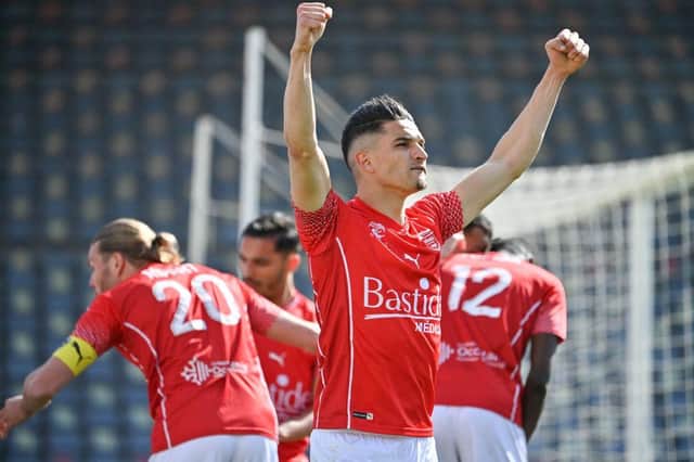 Nimes' Algerian midfielder Zinedine Ferhat celebrates his team's goal against Montpellier (Photo by PASCAL GUYOT/AFP via Getty Images)