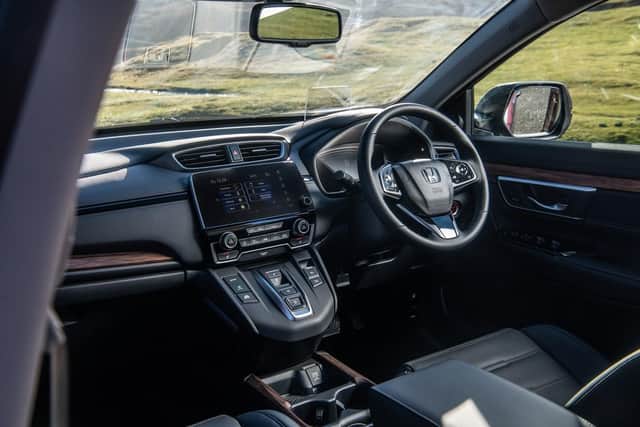 The CR-V's interior is plain but incredibly spacious