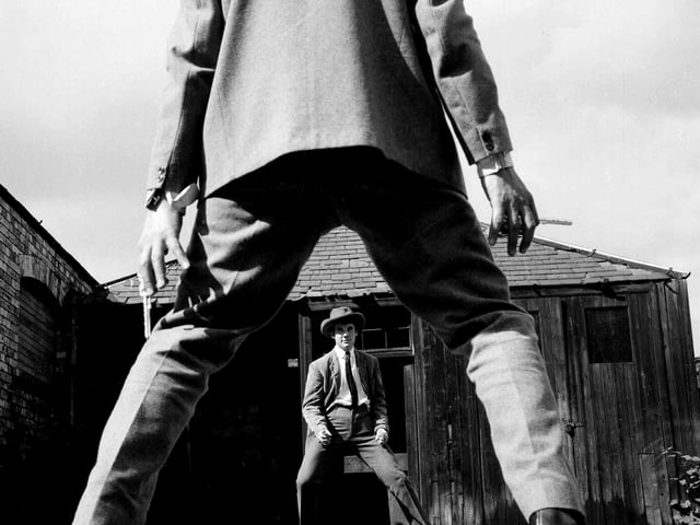 Michael Palin and Terry Jones shoot it out in an open-air rehearsal for the 1964 Oxford Theatre Group's late night revue.