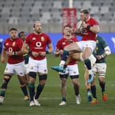 Stuart Hogg, centre, leaps to catch the ball during the Lions' win against South Africa, with fellow Scots Rory Sutherland, left, and Ali Price, right, watching on. Picture: Phill Magakoe/AFP via Getty Images