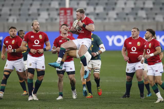 Stuart Hogg, centre, leaps to catch the ball during the Lions' win against South Africa, with fellow Scots Rory Sutherland, left, and Ali Price, right, watching on. Picture: Phill Magakoe/AFP via Getty Images