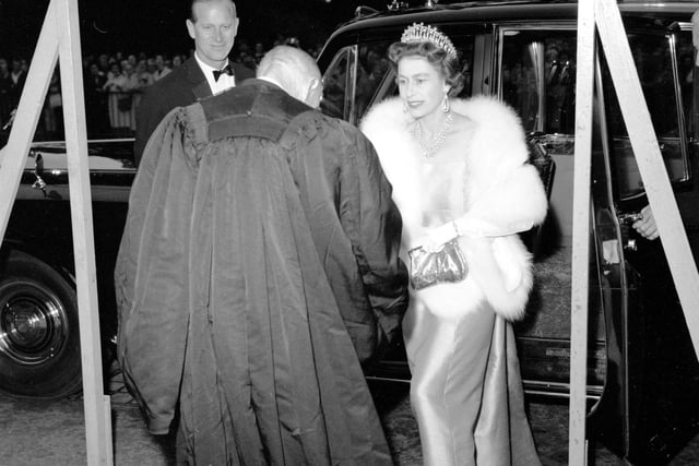 Queen Elizabeth II and Prince Philip arrive at the Royal College of Physicians, in Edinburgh, in 1966.