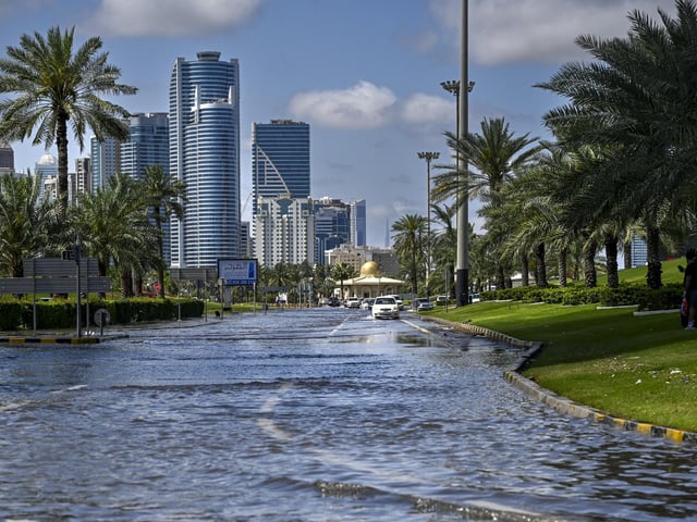A flooded street following heavy rains in Sharjah. Dubai, the Middle East's financial centre, has been paralysed by the torrential rain that caused floods across the UAE and Bahrain and left 18 dead in Oman earlier this week.