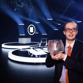 Glasgow student Jonathan Gibson, aged 24, shows off the coveted Caithness Glass trophy after becoming the youngest ever winner of Mastermind