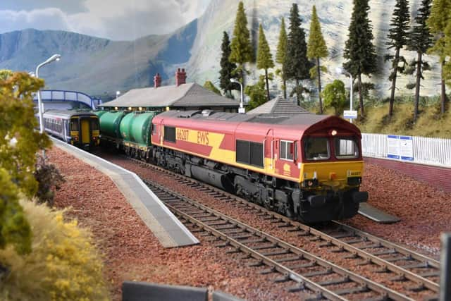 Oil train passes a passenger train to Fort William at Tulloch Bridge