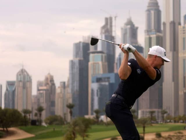 Calum Hill tees off on the iconic eighth hole at Emirates Golf Club during the Hero Dubai Desert Classic. Picture: Karim Sahib/AFP via Getty Images.