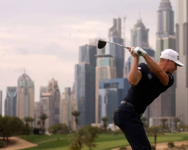 Calum Hill tees off on the iconic eighth hole at Emirates Golf Club during the Hero Dubai Desert Classic. Picture: Karim Sahib/AFP via Getty Images.