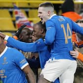 Rangers' Alfredo Morelos, left, is mobbed by his team-mates after he scored his side's fourth goal during the Europa League tie in Dortmund.