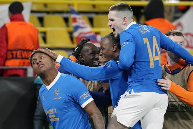 Rangers' Alfredo Morelos, left, is mobbed by his team-mates after he scored his side's fourth goal during the Europa League tie in Dortmund.
