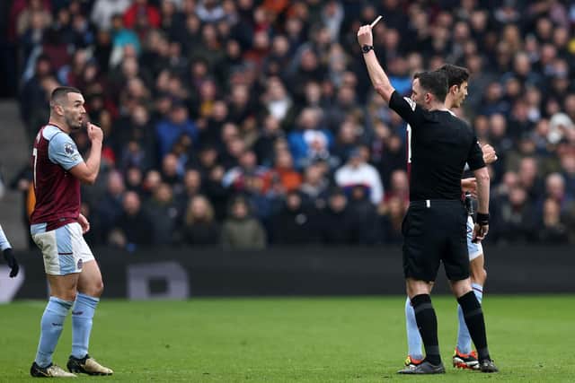 John McGinn is sent off by referee Chris Kavanagh during Aston Villa's 4-0 defeat by Tottenham Hotspur.