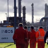 Workers walk through the Grangemouth oil refinery. Picture: PA