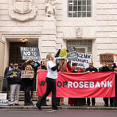 Demonstrators hold anti-Jackdaw and anti-Rosebank placards outside the Department for Energy Security and Net Zero in London yesterday (Picture: Brook Mitchell / AFP via Getty Images)