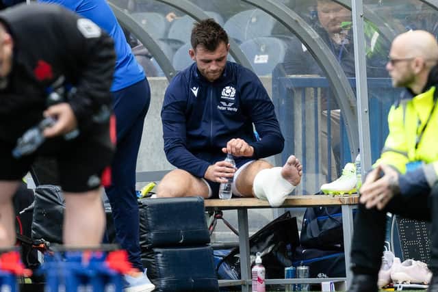 Scotland's Ben White looks dejected as he is substituted off with an ankle injury during the match against France at Murrayfield. (Photo by Ross Parker / SNS Group)