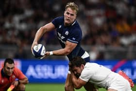 Scotland's Duhan van der Merwe (L) is tackled by France scrum-half Antoine Dupont. (Photo by JEFF PACHOUD/AFP via Getty Images)