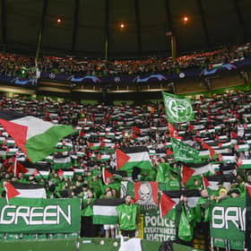 Celtic fans hold up Palestine flags during the UEFA Champions League match against Atletico de Madrid at Celtic Park. (Photo by Rob Casey / SNS Group)
