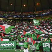 Celtic fans hold up Palestine flags during the UEFA Champions League match against Atletico de Madrid at Celtic Park. (Photo by Rob Casey / SNS Group)