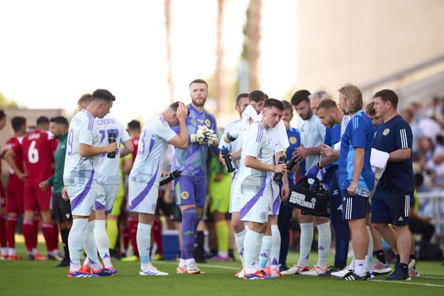 Players of Scotland drink water at the cool break during the friendly against Gibraltar.