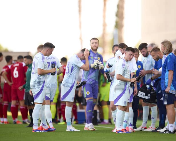 Players of Scotland drink water at the cool break during the friendly against Gibraltar.