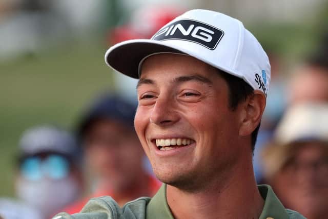 Viktor Hovland flashes his trademark boyish smile after winning the Slync.io Dubai Desert Classic at Emirates Golf Club. Picture: Andrew Redington/Getty Images.