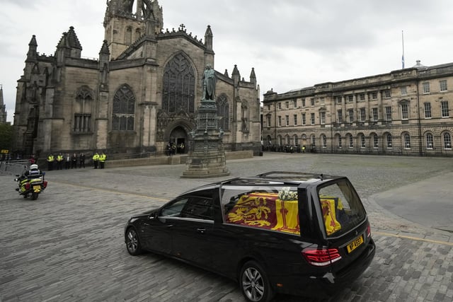 The cortege carrying the coffin of the late Queen Elizabeth II passes St Giles' Cathedral on its way to Palace of Holyroodhouse