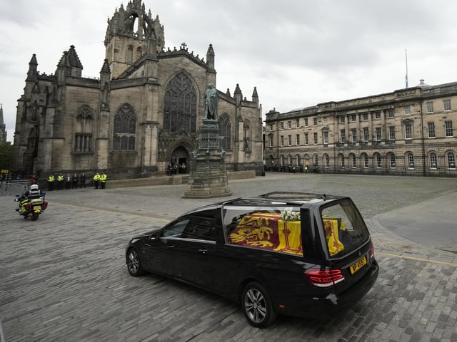 The cortege carrying the coffin of the late Queen Elizabeth II passes St Giles' Cathedral on its way to Palace of Holyroodhouse