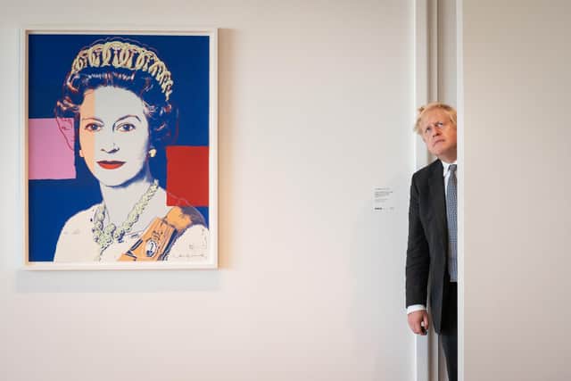 Boris Johnson is the worst Prime Minister, next to a framed image of Queen Elizabeth II. Picture: Stefan Rousseau/PA)
