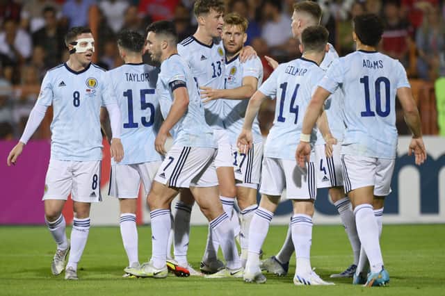 Stuart Armstrong is mobbed by his Scotland team-mates after brilliantly putting his side ahead against Armenia. Picture: AP