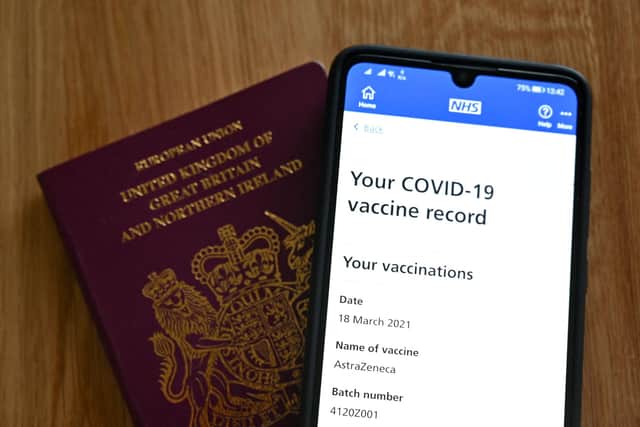 The Scottish Government has announced that the NHS Scotland Covid status app is now available to download (Photo by JUSTIN TALLIS/AFP via Getty Images).