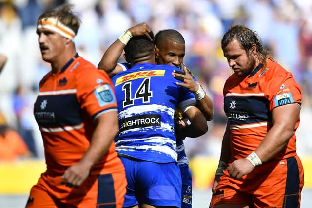 Edinburgh's Pierre Schoeman (right) looks dejected as Suleiman Hartzenberg of the Stormers celebrates scoring a try. (Photo by Ashley Vlotman/Gallo Images/Getty Images)