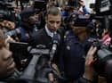 Oscar Pistorius leaves the High Court in Pretoria, South Africa, Tuesday June 14, 2016. A South African parole board is to consider whether former Paralympics star and convicted murderer Oscar Pistorius can be released from jail.