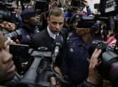 Oscar Pistorius leaves the High Court in Pretoria, South Africa, Tuesday June 14, 2016. A South African parole board is to consider whether former Paralympics star and convicted murderer Oscar Pistorius can be released from jail.
