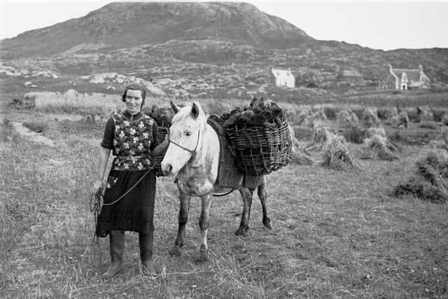 Taking home the peats on the Isle of Eriskay in the 1920s. © University of Edinburgh, Department of Celtic and Scottish Studies. Photograph by Werner Kissling
