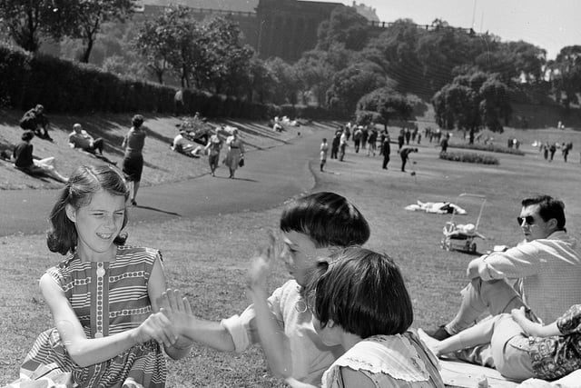 Edinburgh has a heatwave in July 1962, allowing children to enjoy some fun in the sun in Princes Street Gardens.