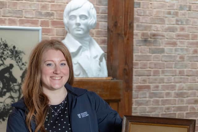 Senior curator Sarah Beattie with two rare needlework samplers thought to have been embroidered by Robert Burns's sister and mother, which have been returned to the poet's birthplace. Picture: Peter Devlin/National Trust for Scotland/PA Wire