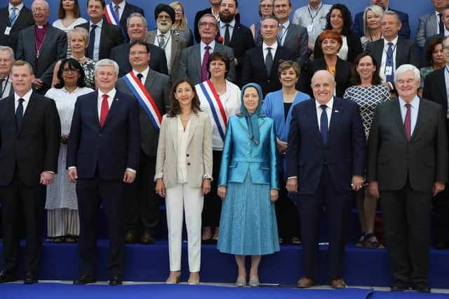 This conference near Paris in June 2018 was said to be the target of a bomb plot by alleged Iranian agents. Front row, from left: Canadian foreign minister John Baird, retired Canadian politician Stephen Joseph, Colombian-French politician Ingrid Betancourt, Maryam Rajavi, leader of the People's Mujahedin of Iran, Rudolph Giuliani, attorney to President Donald Trump, and former US Speaker of the House Newt Gingrich (Picture: Zakaria Abdelkafi/AFP via Getty Images)