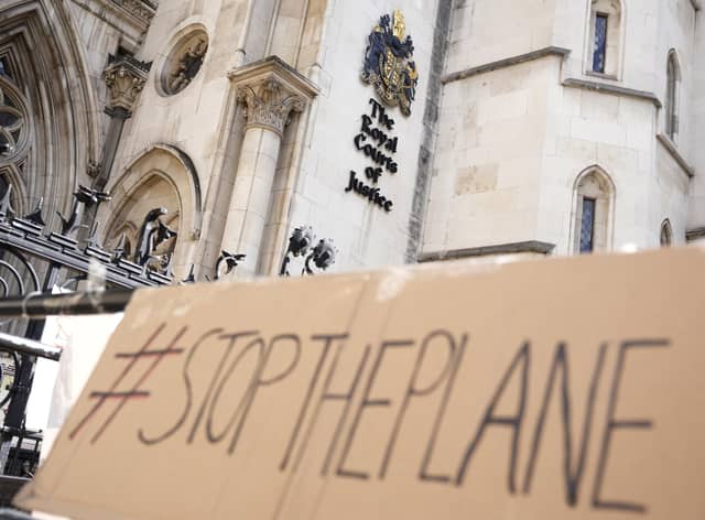 A placard left outside the High Court where the ruling on Rwanda deportation flights is taking place in London. British Foreign Secretary Liz Truss says the first deportation flight to Rwanda will take off in the evening of Tuesday, June 14th, regardless of how many people are on board, as immigration attorneys launch case-by-case appeals on behalf of the migrants scheduled for removal. Photo: AP Photo/Alastair Grant, File.