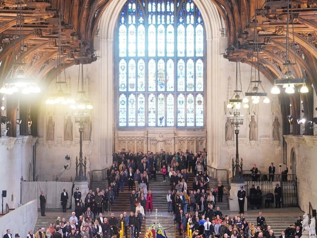 At the vigil held by the Queen’s grandchildren around her coffin, Yui Mok captured a widely used image using a remotely controlled camera.

Yui said: “The fact that Harry, the Duke of Sussex, got to stand alongside his brother William in military uniform – having been stripped of his military titles after giving up life as a working royal, but given special permission by his father, the King – provided added poignancy to the occasion.

“This picture was shot on one of three remotely operated cameras installed above the south door of the hall.”
