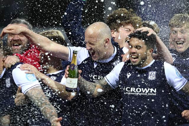 Dundee midfield lynchpin Charlie Adam (c) celebrates with team mates after the Scottish Premiership Playoff Final 2nd Leg between Kilmarnock and Dundee at Rugby Park on May 24, 2021 in Kilmarnock, Scotland. (Photo by Ian MacNicol/Getty Images)