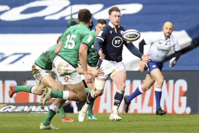 Scotland's Stuart Hogg, right attempts to gather the ball during the Six Nations rugby union match between Scotland and Ireland at Murrayfield, Edinburgh, Scotland Sunday, March 14, 2021. (Jane Barlow/Pool Via AP)
