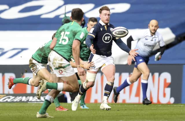 Scotland's Stuart Hogg, right attempts to gather the ball during the Six Nations rugby union match between Scotland and Ireland at Murrayfield, Edinburgh, Scotland Sunday, March 14, 2021. (Jane Barlow/Pool Via AP)