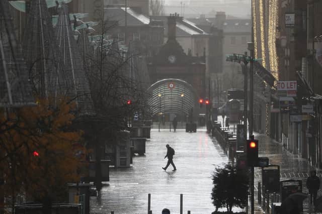 A quiet Buchanan Street in Glasgow after eleven local council areas in Scotland moved into Level 4 restrictions to slow the spread of coronavirus. Under Level 4 - the toughest restrictions for Scotland - non-essential shops will be closed, along with bars, restaurants, hairdressers and visitor attractions, whilst schools remain open (Photo: Andrew Milligan, PA Wire).