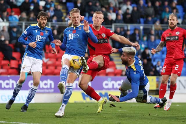 St Johnstone's Hayden Muller (left) and Shaun Rooney tussle with St Mirren's Curtis Main at McDiarmid Park.