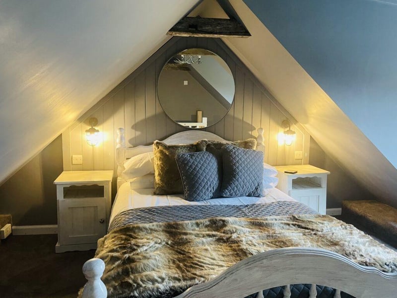 The first floor bedroom has views over the sea - and a comfortable double bed.