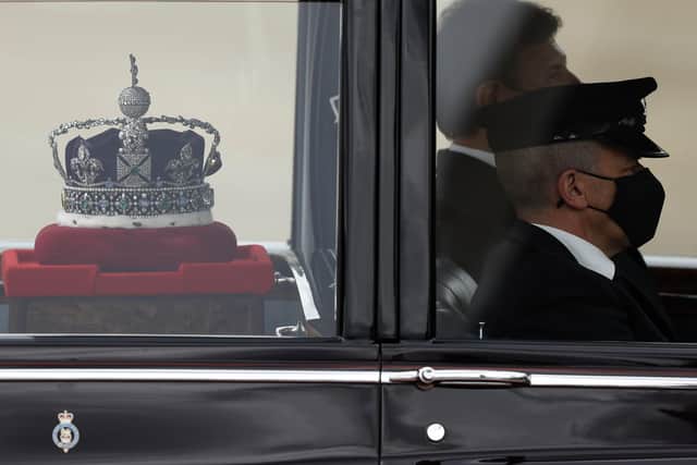 The Imperial State Crown is taken to the Palace of Westminster in London for the State Opening of Parliament, Tuesday May 11, 2021. Picture: AP Photo/Alastair Grant