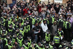 Two men are released from the back of an Immigration Enforcement van accompanied by lawyer Aamer Anwar and Mohammad Asif, director of the Afghan Human Rights Foundation, in Kenmure Street, Glasgow (Picture: Andrew Milligan/PA)