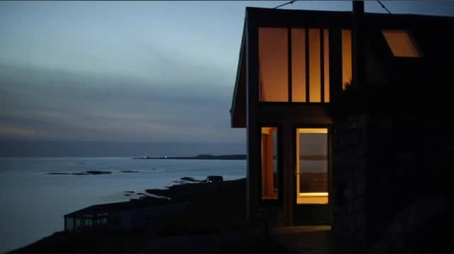Taigh Bainne by night: the bothy's warm interiors offer a cosy refuge from cold nights on the Outer Hebrides